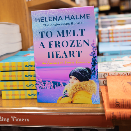 Book titled 'To Melt a Frozen Heart' by Helena Halme in a bookstore setting.